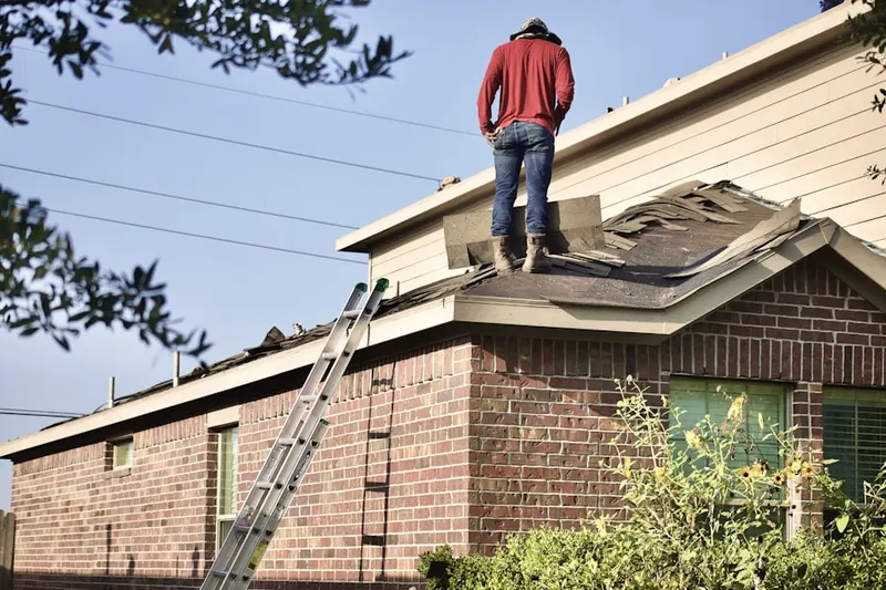Professional roofer working on a residential roof in Downtown Hollywood